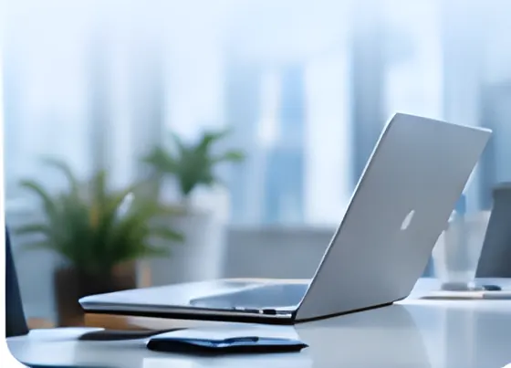 A desk with a laptop